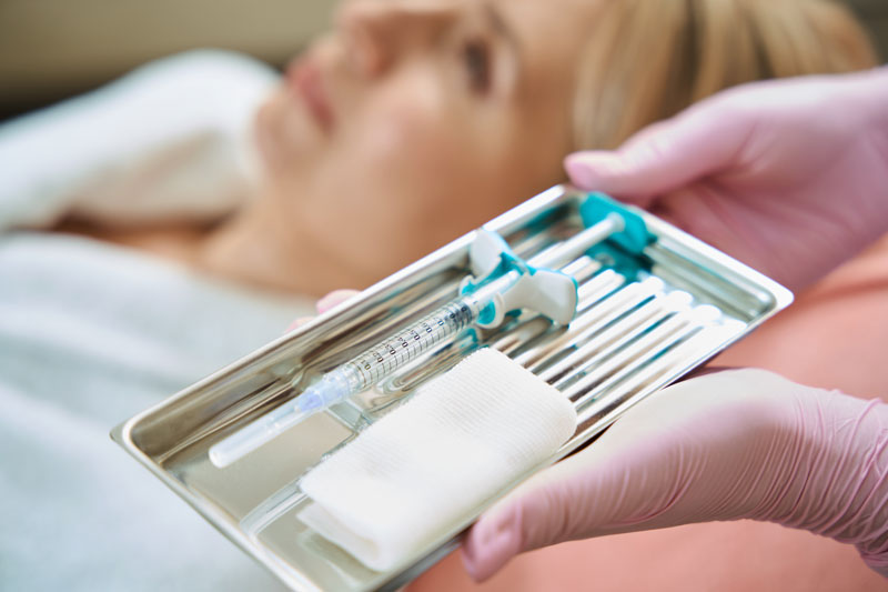 close up of syringe in tray